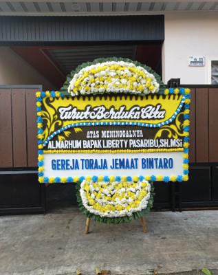 Papan Bunga Duka di Taniwel
